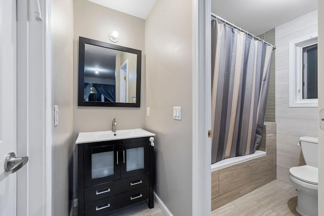 full bathroom featuring vanity, toilet, and shower / tub combo