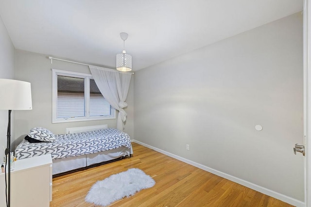 bedroom featuring wood-type flooring