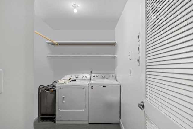 clothes washing area featuring washer and dryer