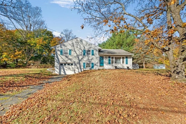 view of front of property with a garage