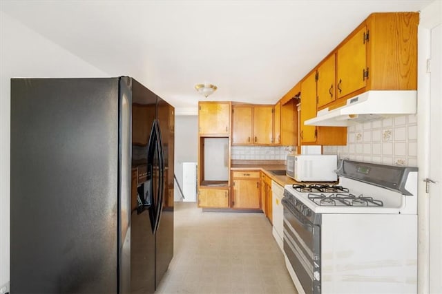 kitchen with decorative backsplash and white appliances