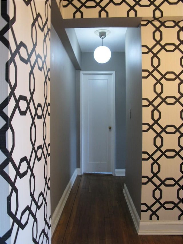 hall with dark hardwood / wood-style floors