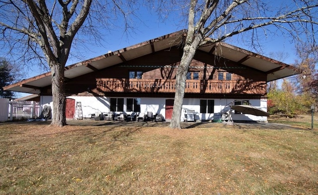 rear view of house with a lawn