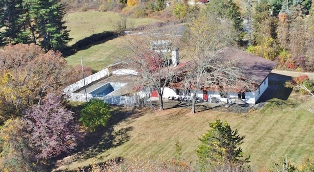 birds eye view of property with a rural view