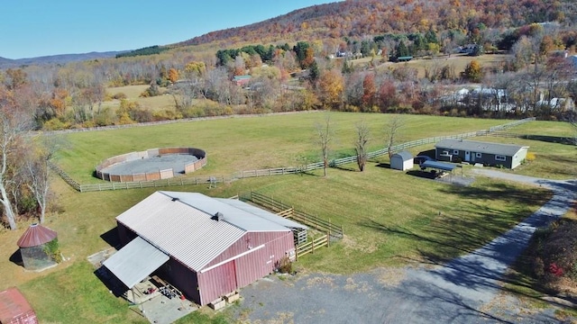 aerial view with a mountain view and a rural view