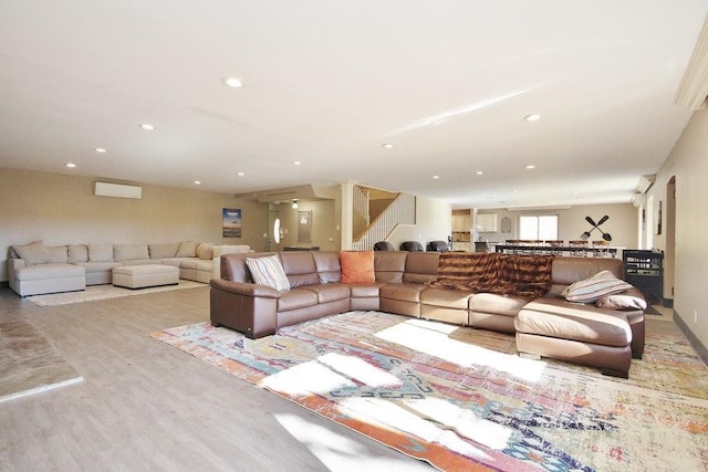 living area featuring stairway, recessed lighting, and wood finished floors