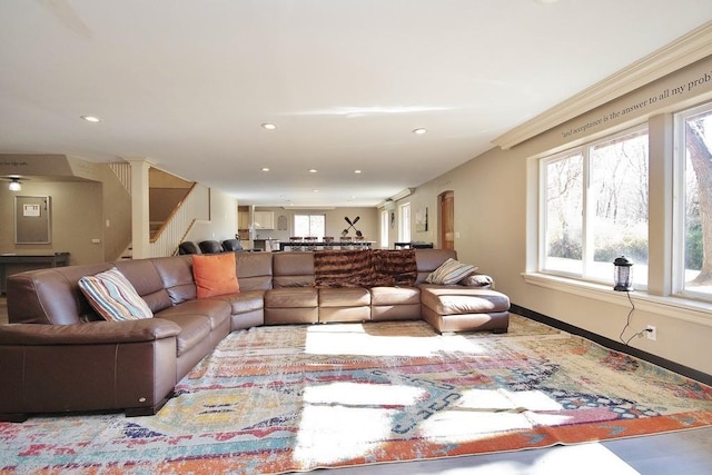 living room with stairway, recessed lighting, and baseboards