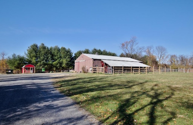 view of pole building featuring fence