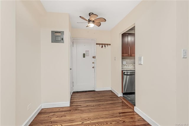 interior space featuring baseboards and wood finished floors