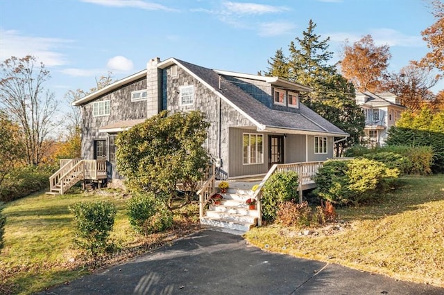 view of front of home with a front lawn and a porch