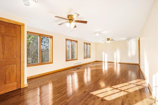 spare room featuring ceiling fan and wood-type flooring