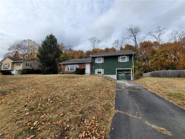 split level home featuring a garage