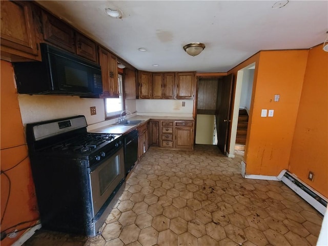 kitchen featuring sink, a baseboard radiator, and black appliances