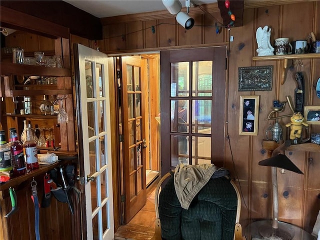 interior space featuring wooden walls and french doors