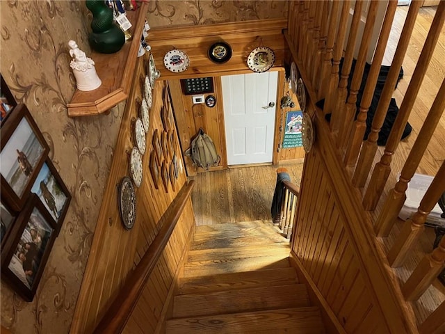 staircase with hardwood / wood-style flooring