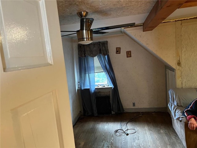 bonus room with beam ceiling and dark hardwood / wood-style floors