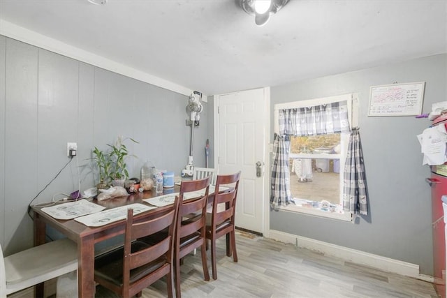 dining space with light wood-type flooring