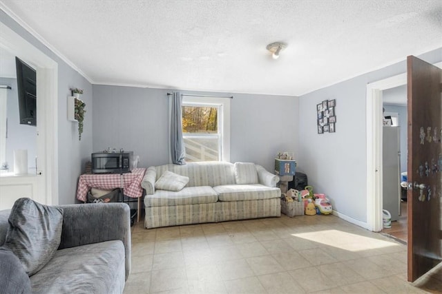 living room with a textured ceiling and crown molding