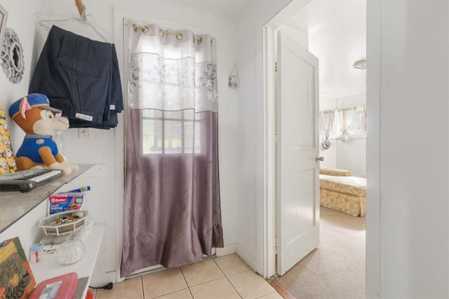 bathroom featuring tile patterned floors and a wealth of natural light