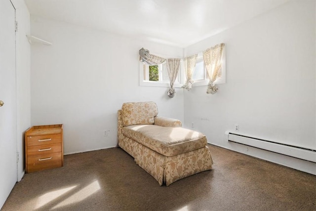 sitting room featuring dark colored carpet and a baseboard radiator