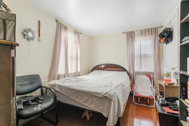 bedroom featuring dark hardwood / wood-style floors