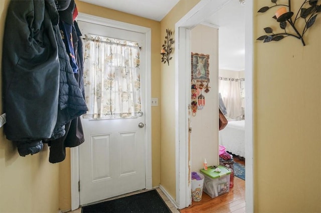 doorway to outside with wood-type flooring