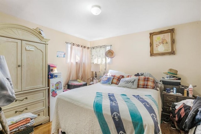 bedroom with light hardwood / wood-style floors