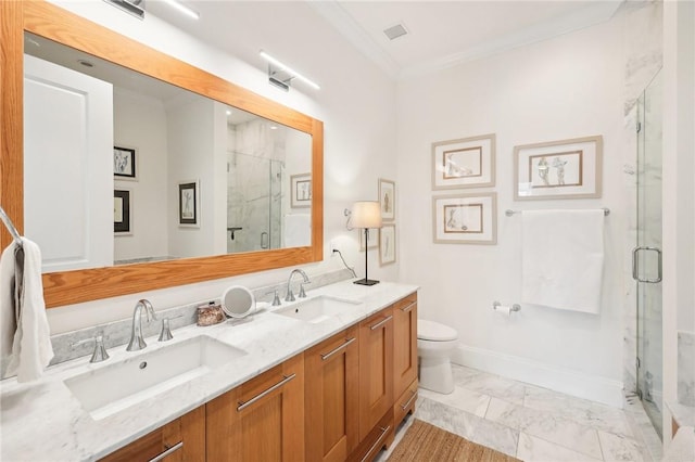 bathroom with toilet, vanity, a shower with shower door, and ornamental molding