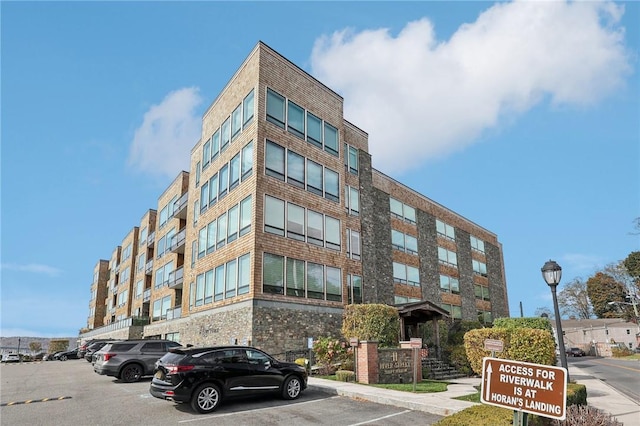 11 River St Unit 401, Sleepy Hollow, NY 10591 - view of building exterior featuring uncovered parking