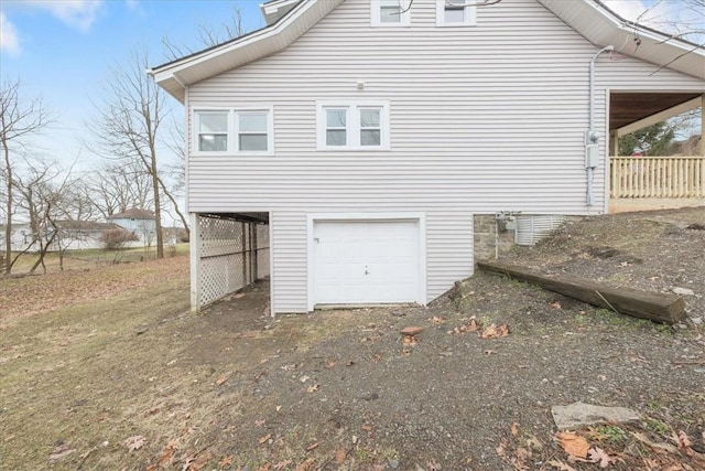 view of side of home with a garage