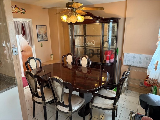 dining room with ceiling fan and light tile patterned flooring