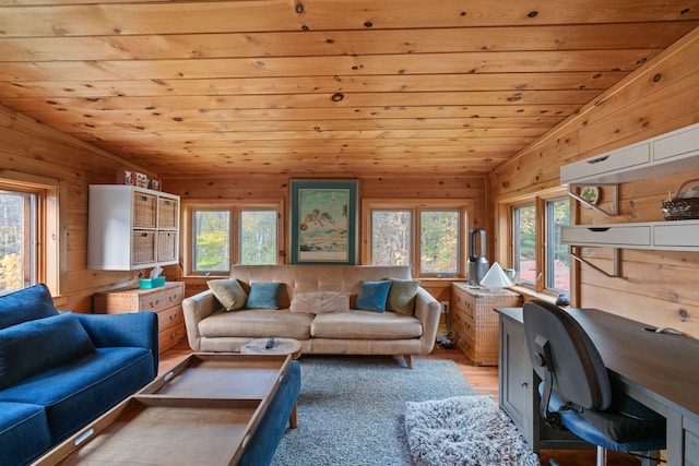 living room featuring wooden walls, wooden ceiling, vaulted ceiling, and light hardwood / wood-style floors