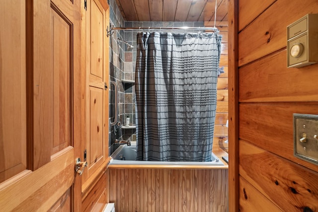 details with shower / bath combination with curtain, wood ceiling, and wood walls