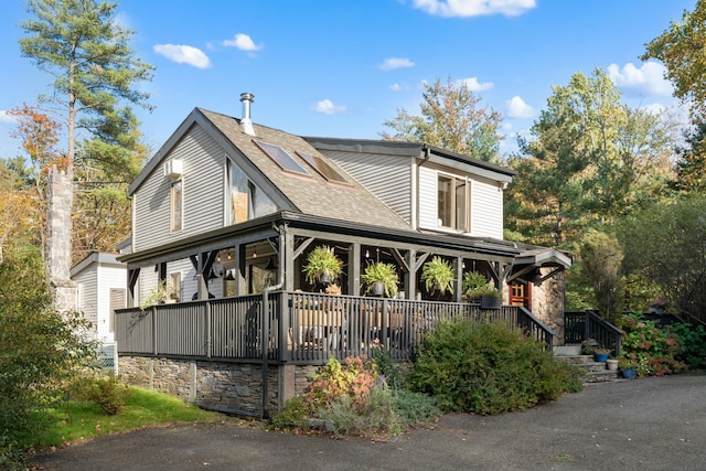 view of property exterior with a porch