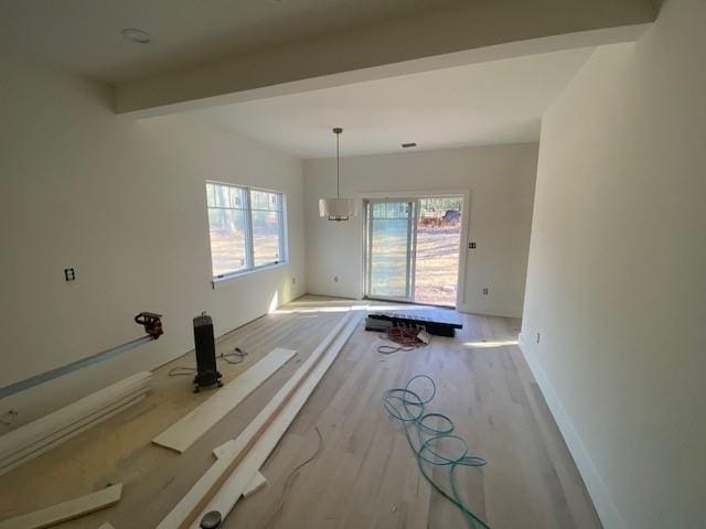 interior space featuring beam ceiling and wood-type flooring