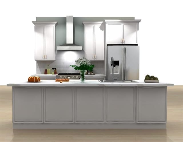 kitchen featuring wall chimney exhaust hood, stainless steel fridge with ice dispenser, backsplash, an island with sink, and gray cabinets