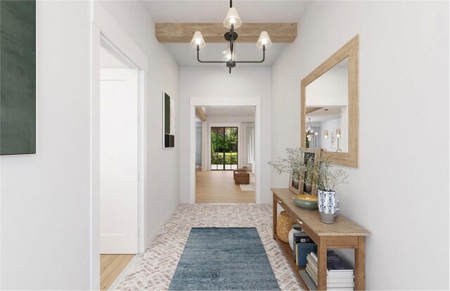 hallway featuring baseboards, beamed ceiling, and a notable chandelier