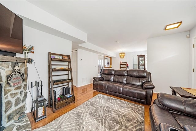 living room featuring hardwood / wood-style floors and a notable chandelier