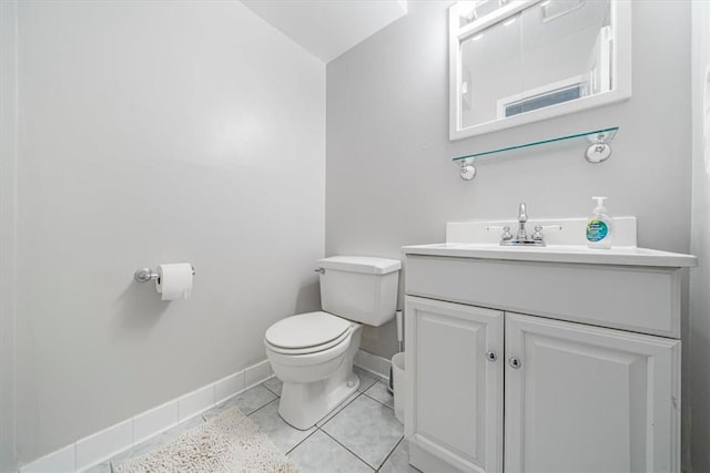 bathroom with tile patterned floors, vanity, and toilet