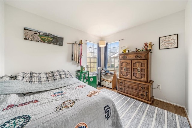 bedroom with wood-type flooring