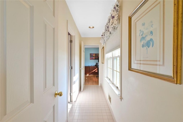 hallway with light tile patterned floors