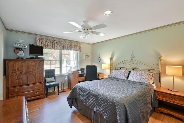 bedroom featuring light hardwood / wood-style flooring, ceiling fan, and crown molding