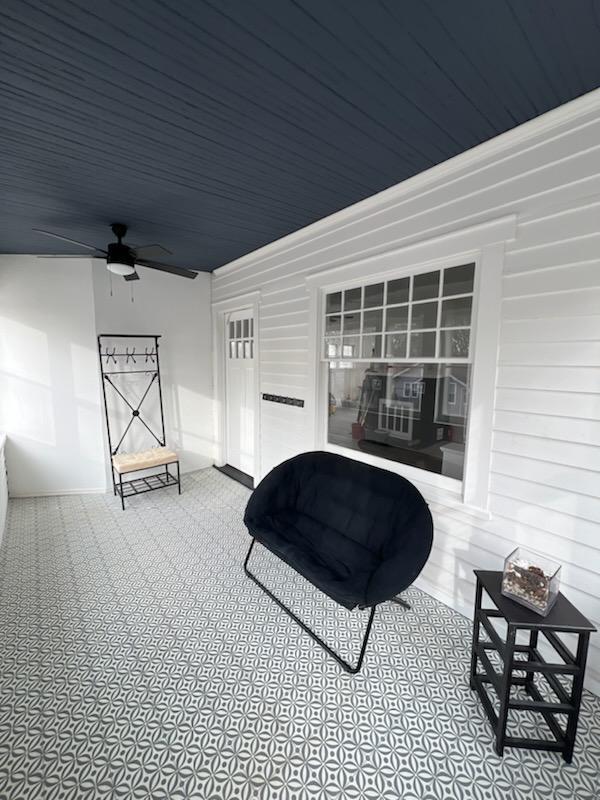 view of patio featuring ceiling fan