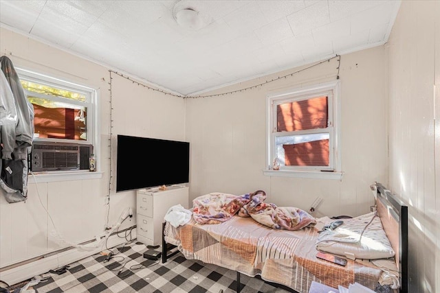 bedroom featuring cooling unit and a baseboard heating unit