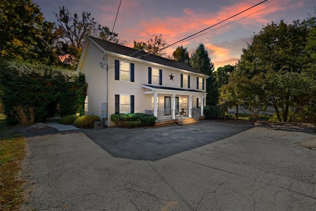 colonial-style house with a porch