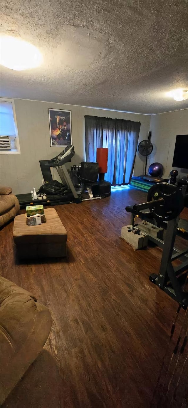 living room featuring hardwood / wood-style floors and a textured ceiling