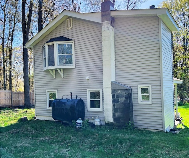 back of house featuring a yard