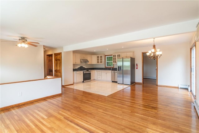 unfurnished living room featuring light wood finished floors, baseboards, a baseboard radiator, a baseboard heating unit, and ceiling fan with notable chandelier