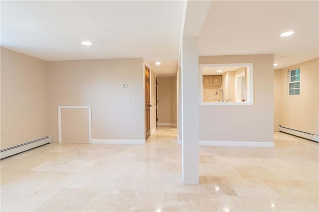 empty room with baseboards, a baseboard heating unit, and recessed lighting