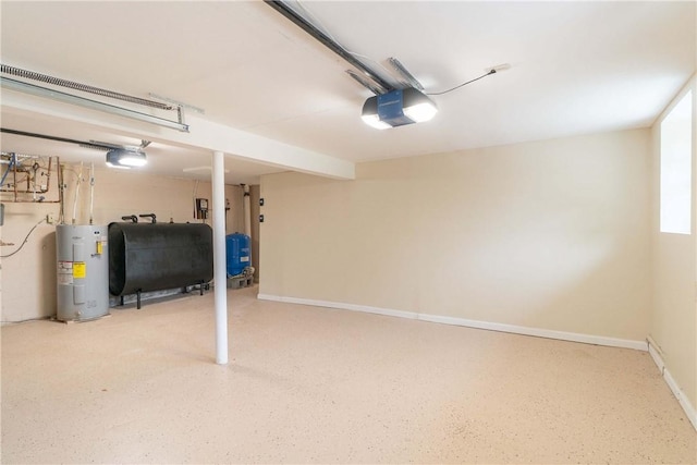 garage with a garage door opener, baseboards, water heater, and heating fuel